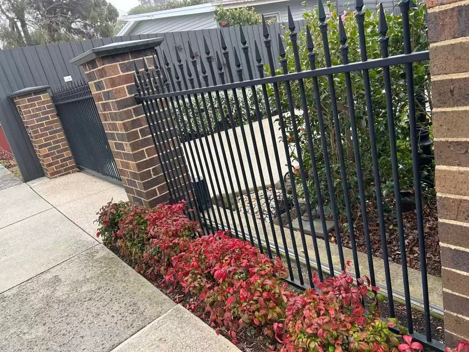 Steel picket fence and sliding gate